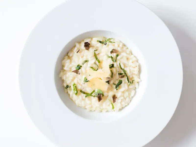 Creamy mushroom risotto garnished with fresh herbs