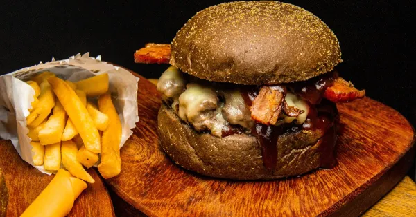 BBQ burger with onion rings and cheese