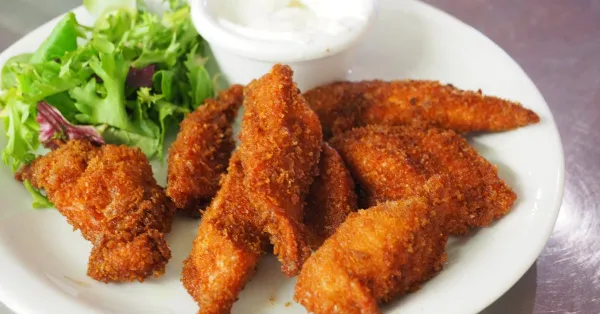 Breaded chicken strips with dipping sauce